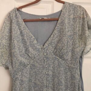 Long baby blue dress with ruffles on front